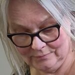 A close up image of textile artist Britta Ankenbauer working in her studio.