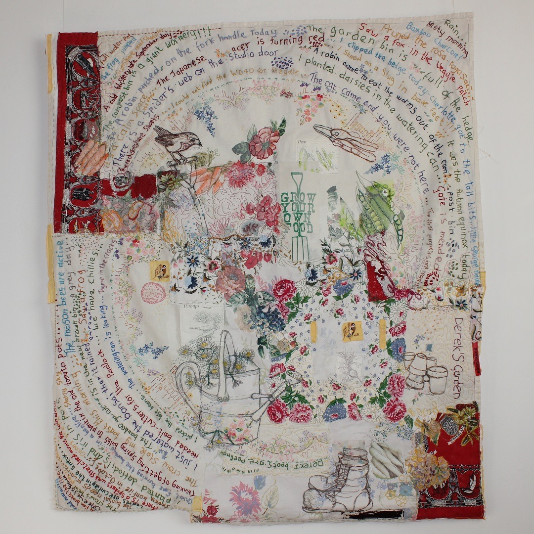 Collage textile art piece with embroidered abstract gardening scene