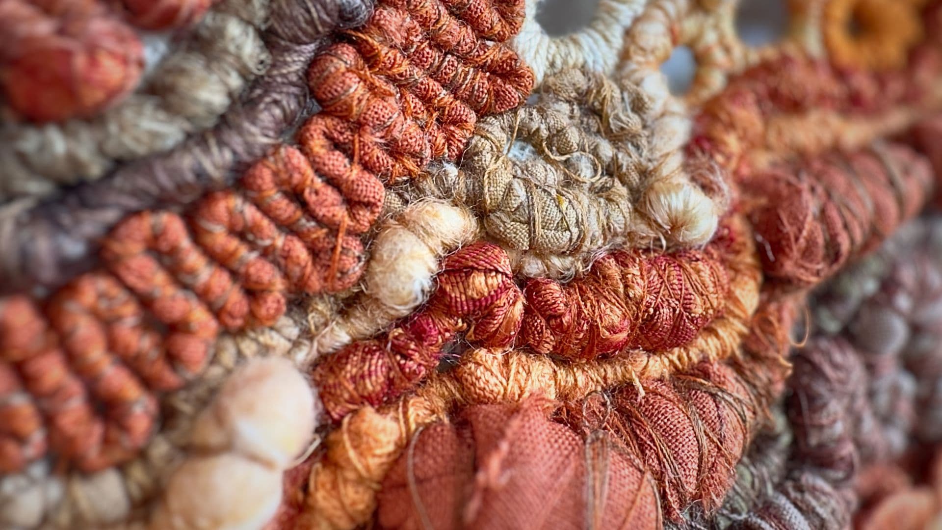 a close up of a mixed media thread embroidery