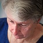 A close up image of textile artist Wendy Dolan working in her studio.
